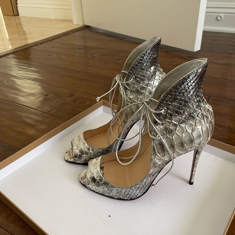 New christian louboutin- Shinny sticker on the bottom of the shoes.